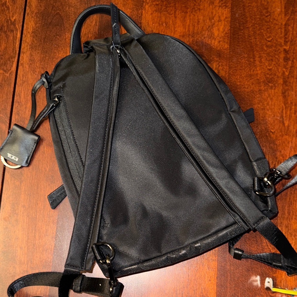 NWOT RARE TUMI Monett Black Camo mini sling backpack - Picture 9 of 9